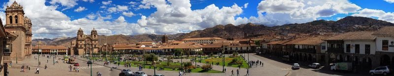 Cusco Plaza de Armas with the cathedral and the hills above the city in morning light
