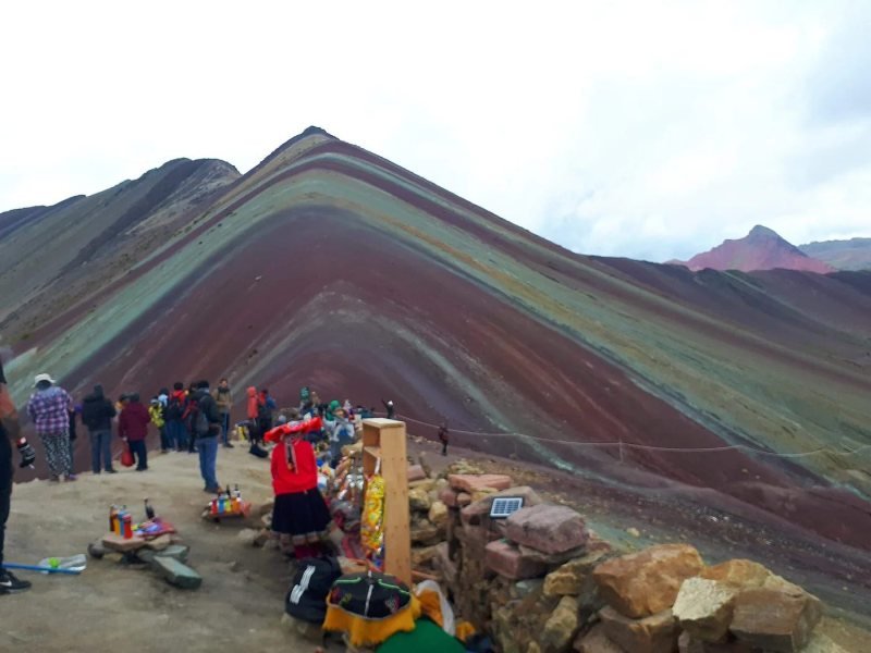 Jagged ridges with thin colored bands above the Layo valley