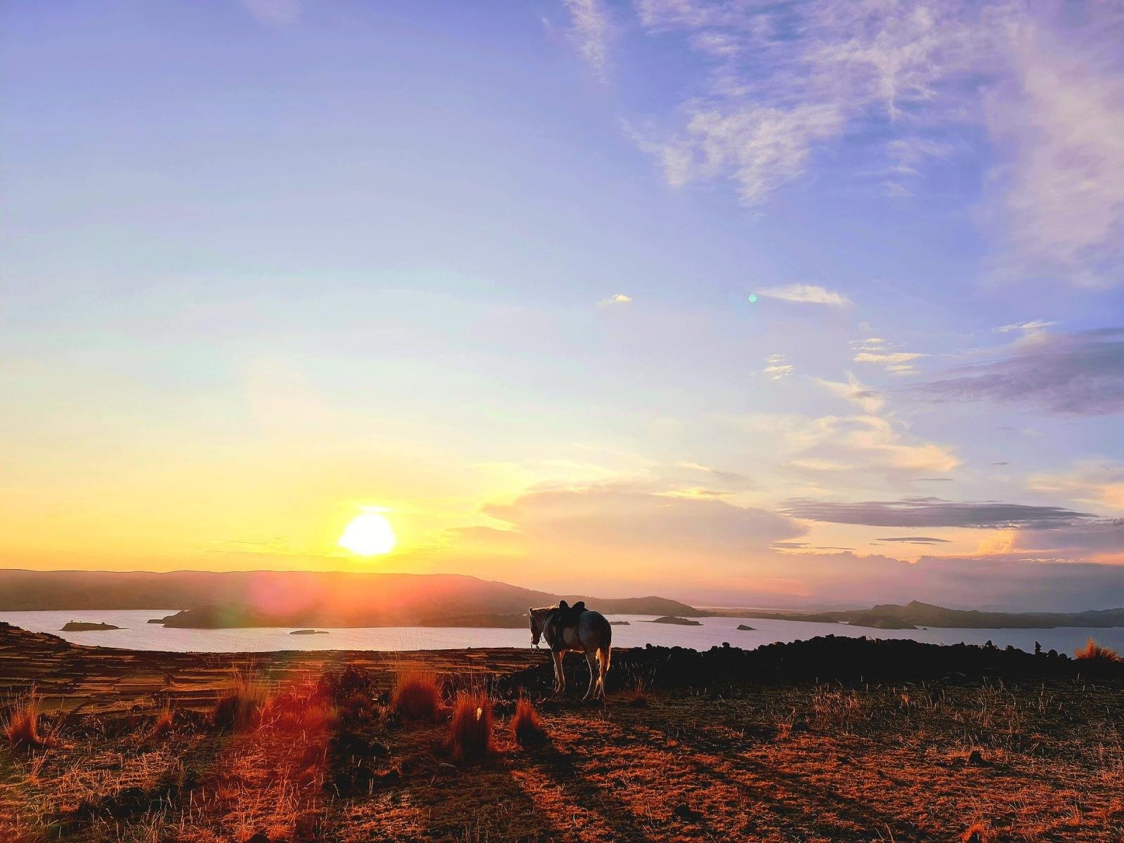Sunset over Lake Titicaca from the Pachatata hilltop on Amantani