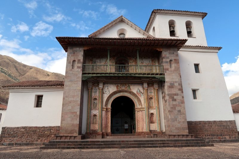 Facade and painted balcony of the San Pedro church in Andahuaylillas