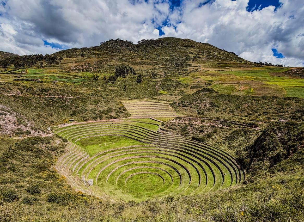 Circular Inca terraces of Moray in April Circular Inca terraces of Moray in April, with green fields and a clearing sky