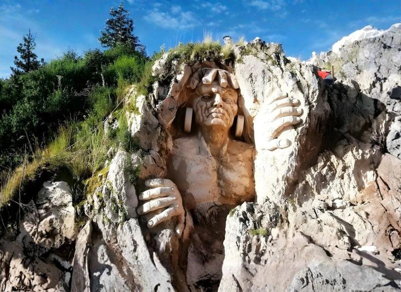 Apukunaq Tianan, Home of the Gods Giant face and hands carved into a white rock outcrop at Apukunaq Tianan