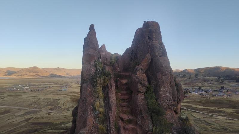 Red sandstone rock spire at the Aramu Muru site near Juli, above the altiplano