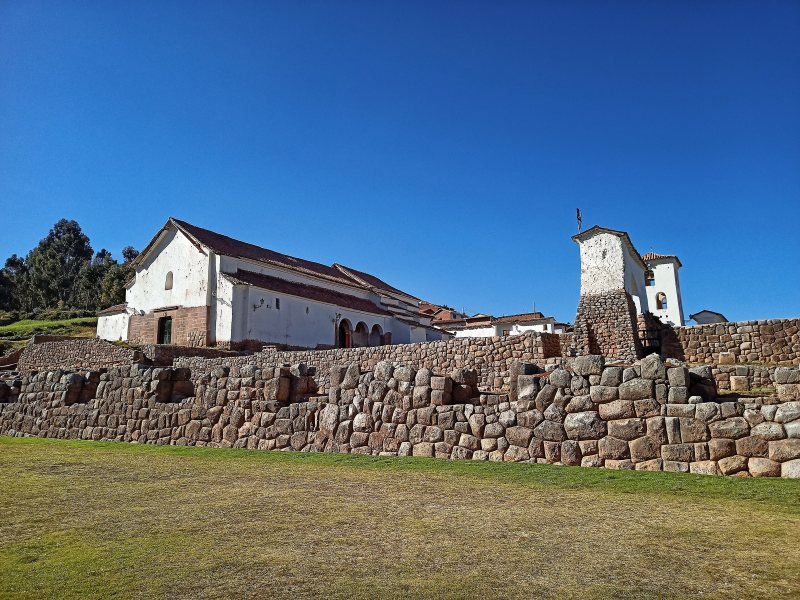 Chinchero church standing on Inca stone walls under a clear sky