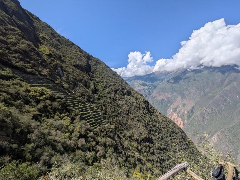 Terraces of Choquequirao running down a steep forested slope above the Apurimac canyon