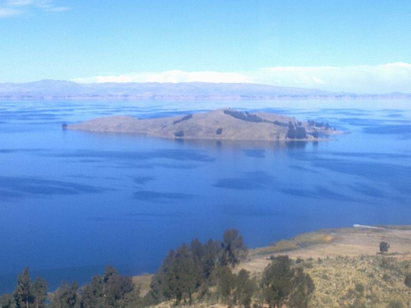 Isla del Sol and Isla de la Luna in the blue water of Lake Titicaca seen from Copacabana