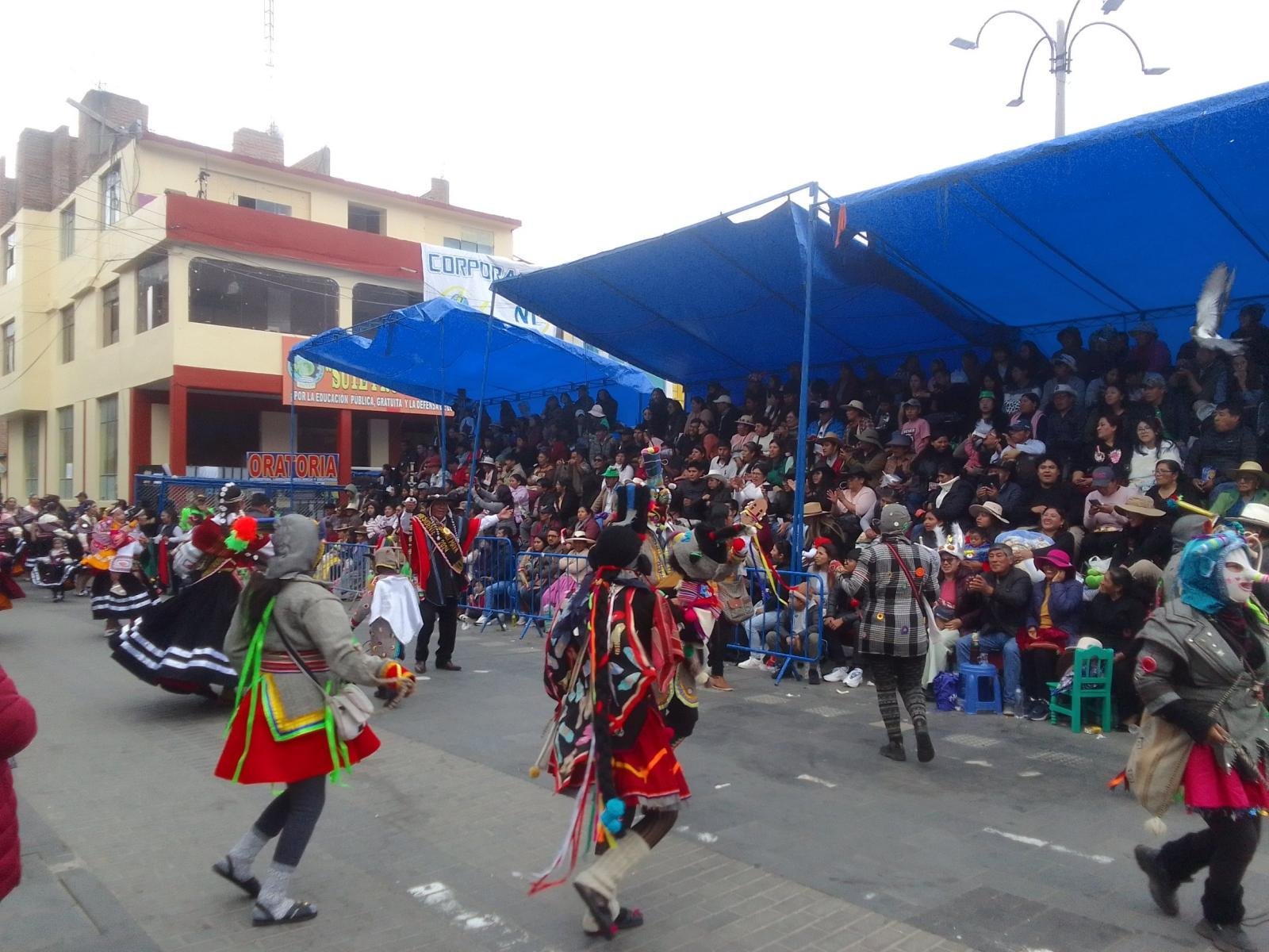 Dancers in the Candelaria parade in Puno in February Dancers in the Candelaria parade in Puno in February, with spectators in the covered stands