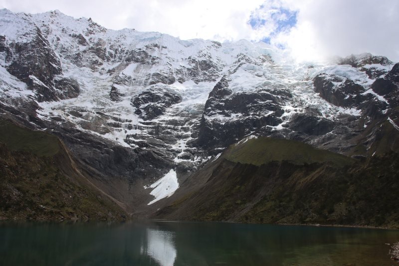 Glacier of Nevado Humantay above the dark water of Humantay Lake