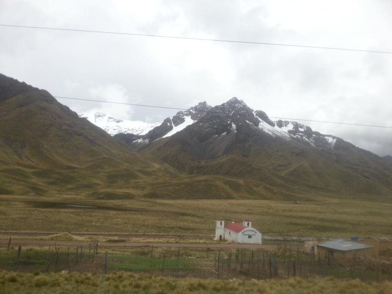 Snowy peaks above the grassland of the La Raya pass between Cusco and Puno