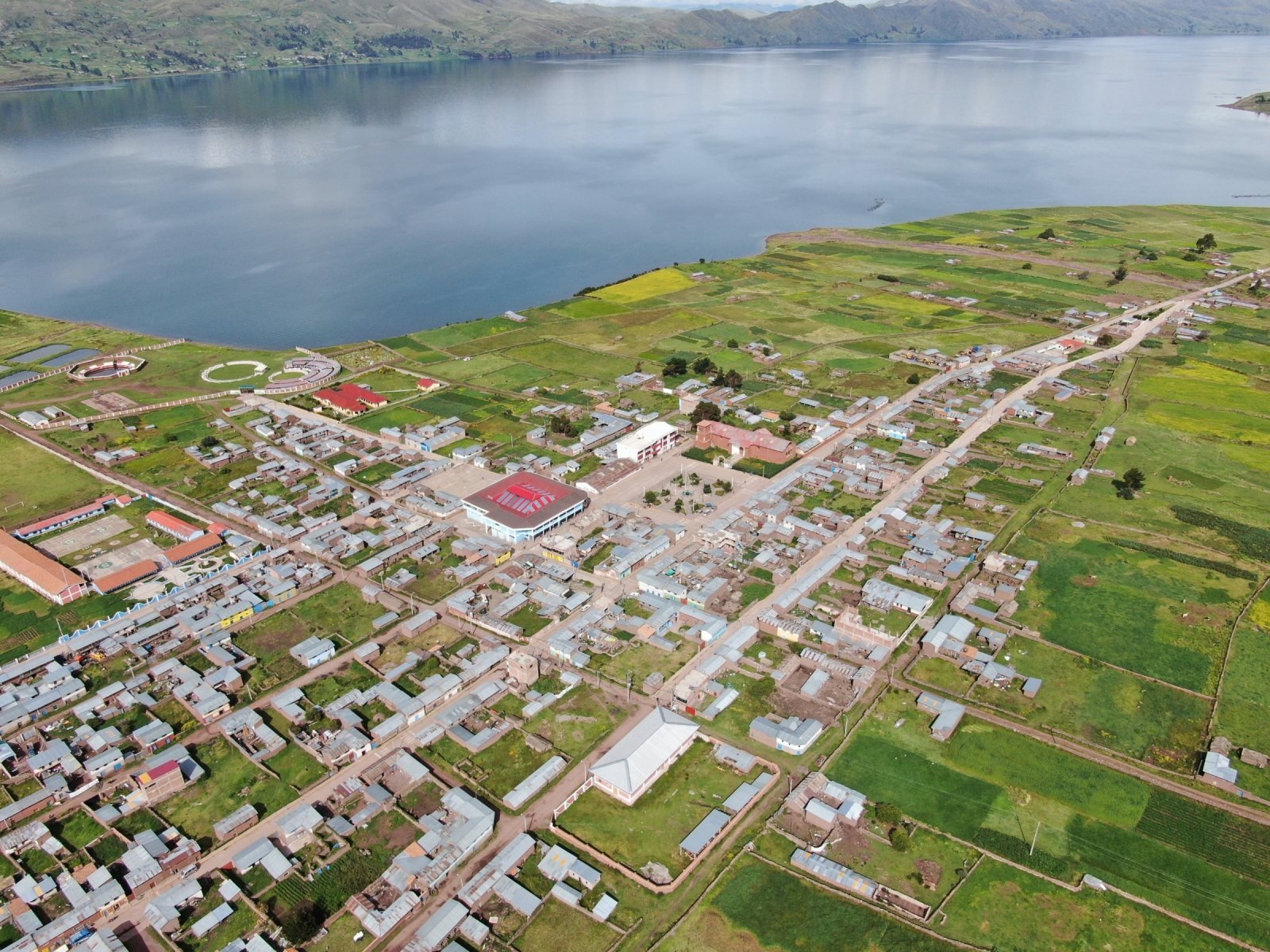 Aerial view of Layo village and its fields beside Lake Langui Layo