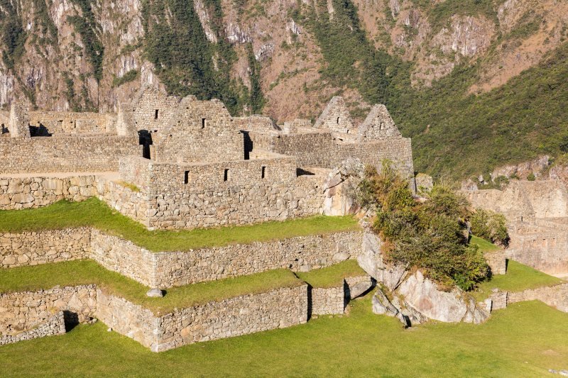 Two-story stone houses above the terraces of Machu Picchu