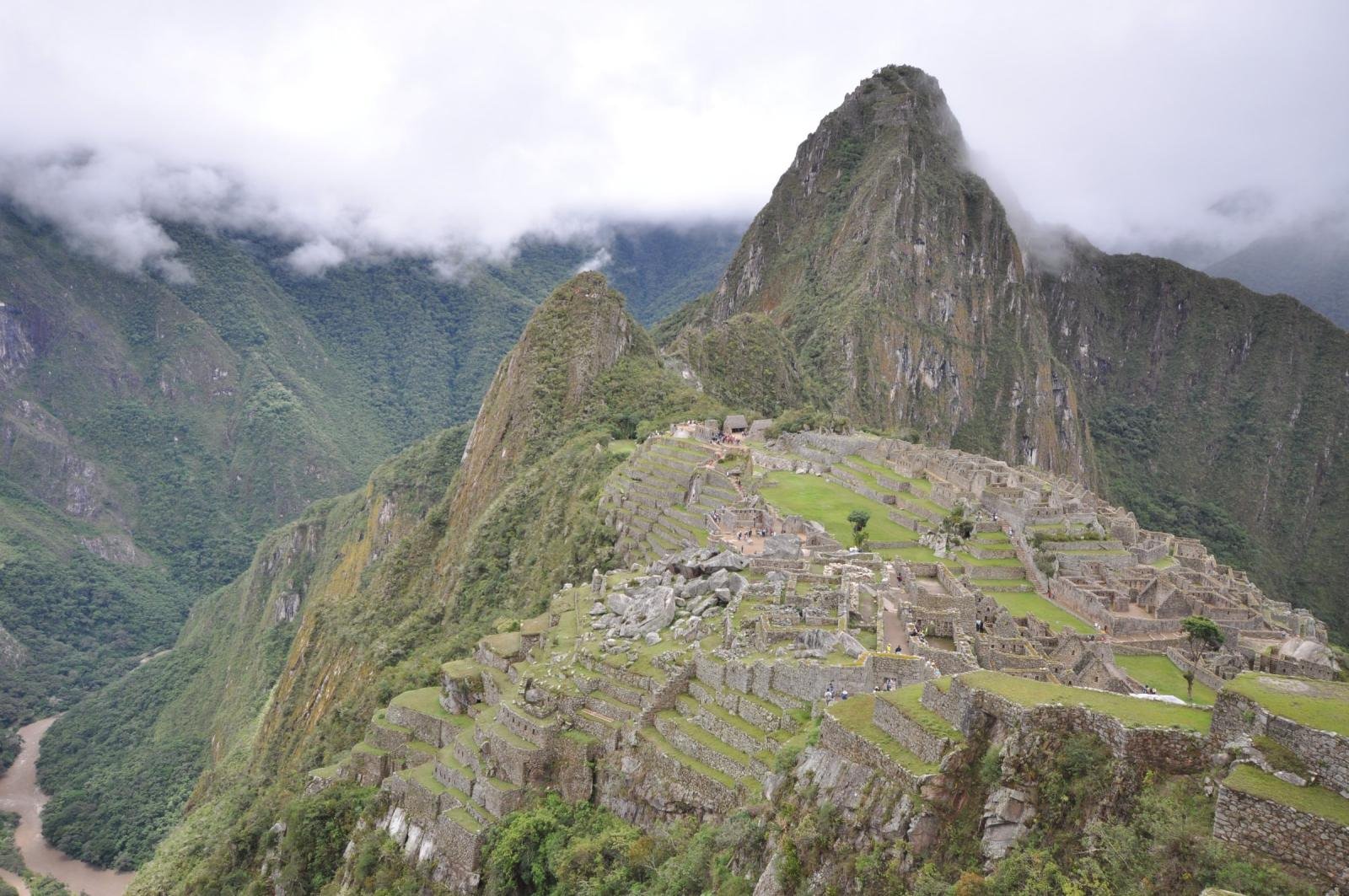 Machu Picchu above the Urubamba Machu Picchu on its ridge with Huayna Picchu behind and the Urubamba River far below