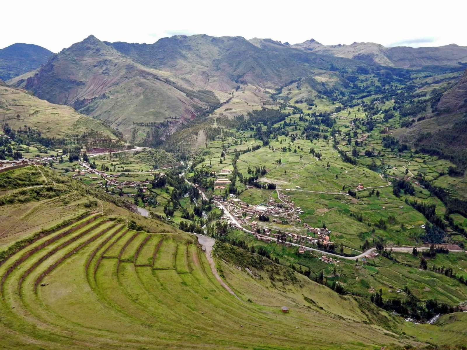 Pisac terraces in March Green Pisac terraces above the Sacred Valley floor in March under a cloudy sky