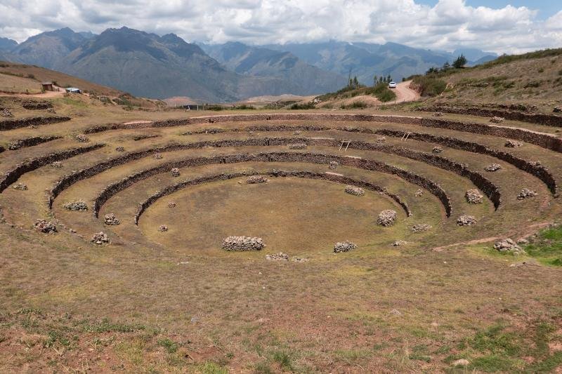 Circular terraces of Moray with the snowy peaks of the Urubamba range on the horizon