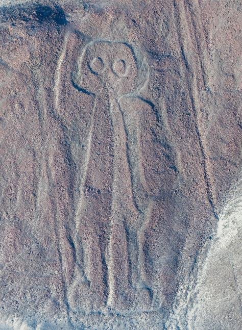 The astronaut figure on a hillside at Nazca, seen from the overflight plane