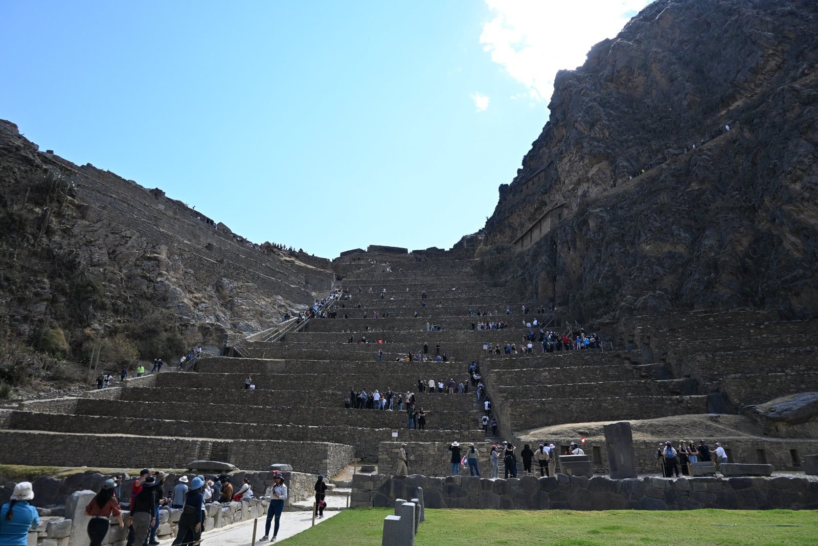 Stone terraces of the Ollantaytambo fortress rising above the town plaza