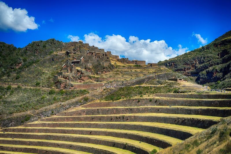 Curved Inca terraces of Pisac above the Sacred Valley with the Urubamba River below