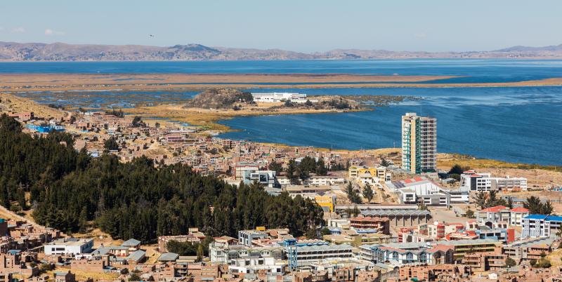 Puno Puno and the bay of Lake Titicaca seen from above on a sunny day