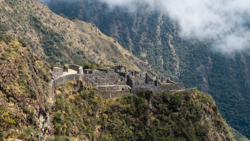 Sayacmarca ruins on a cliff edge above the cloud forest on the Inca Trail