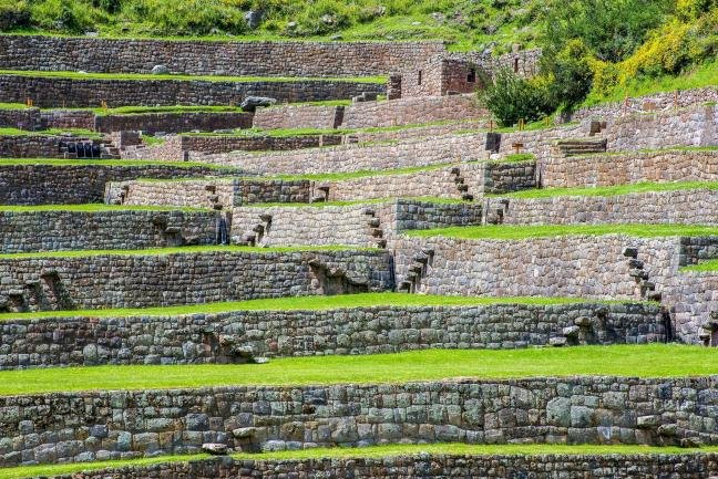 Tipon Stone-walled terraces with green lawns stepping down at Tipon