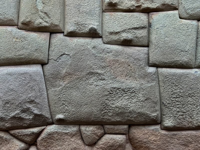 The twelve-angled stone fitted into the Inca wall on Hatun Rumiyoc street in Cusco