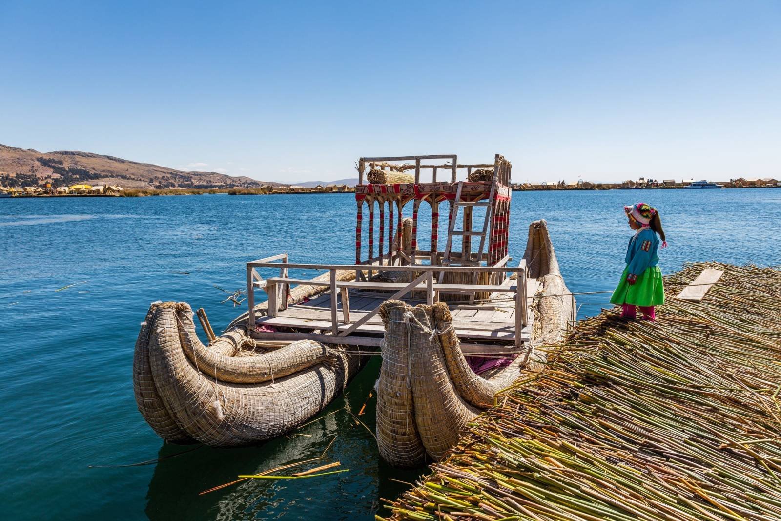 Reed boats of the Uros Reed boats moored at a floating Uros island on Lake Titicaca