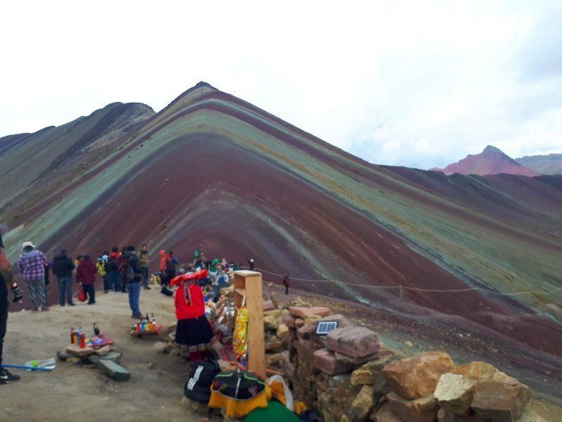 Striped slopes of Vinicunca seen from the crowded viewpoint